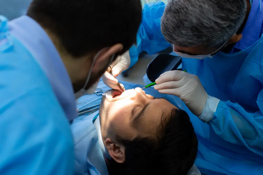 Patient with gauze on bleeding extraction site receiving emergency dental care in Fairfield CA