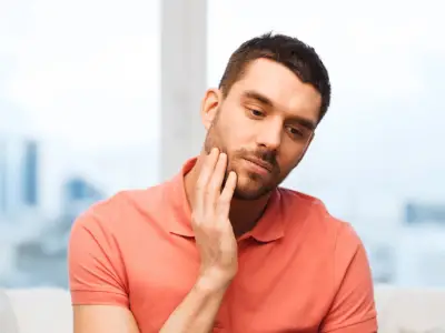 Person with jaw pain needing TMJ evaluation in Fairfield CA