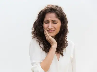 Woman with severe toothache needing same-day relief in Fairfield CA