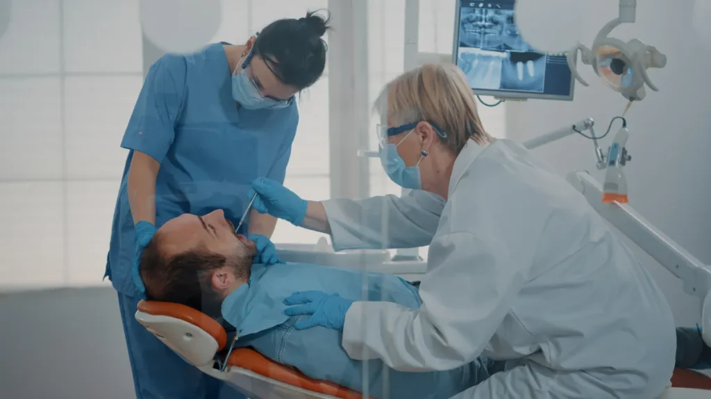 Dentist checking a sore tooth after a filling at Emergency Dentist Fairfield, Fairfield, CA 94534